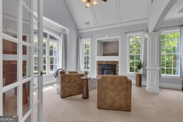 140 Olivia Ct, Fayetteville, GA 30215 - living room featuring light colored carpet, vaulted ceiling, a stone fireplace, a ceiling fan, and arched walkways