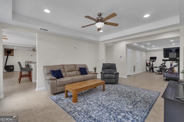 140 Olivia Ct, Fayetteville, GA 30215 - living room featuring a raised ceiling, a ceiling fan, recessed lighting, and light tile patterned flooring