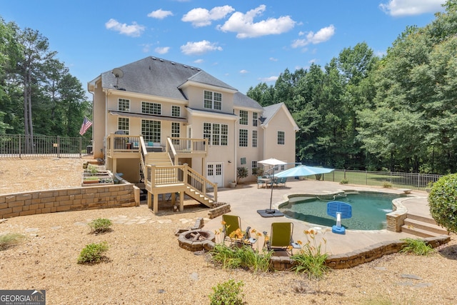 140 Olivia Ct, Fayetteville, GA 30215 - rear view of property featuring a fire pit, a fenced backyard, a patio, a wooden deck, and stairs