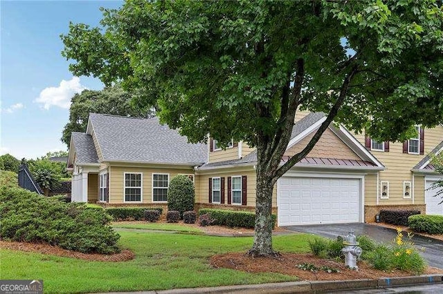 2721 Grapevine Cir Unit 1701, Cumming, GA 30041 - view of front of property featuring brick siding, asphalt driveway, an attached garage, and a front yard