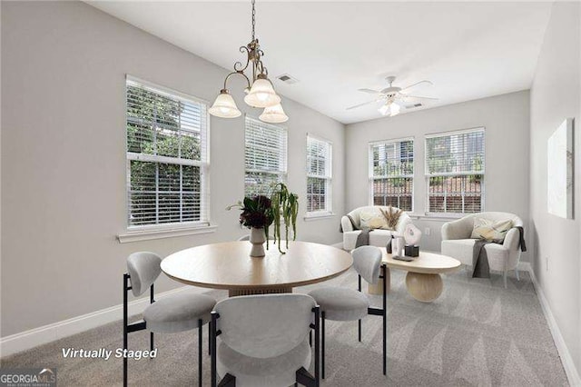 2721 Grapevine Cir Unit 1701, Cumming, GA 30041 - dining room featuring carpet floors, healthy amount of natural light, and a ceiling fan