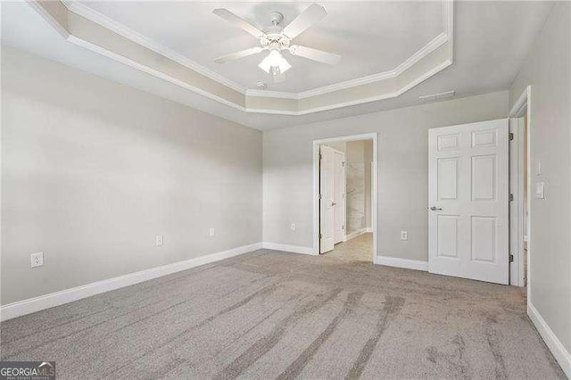 2721 Grapevine Cir Unit 1701, Cumming, GA 30041 - unfurnished bedroom featuring a tray ceiling, crown molding, carpet flooring, ensuite bathroom, and ceiling fan