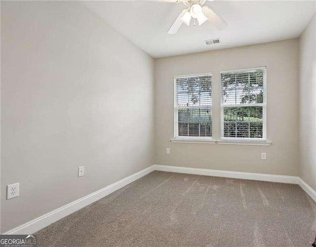 2721 Grapevine Cir Unit 1701, Cumming, GA 30041 - carpeted spare room featuring a ceiling fan and baseboards