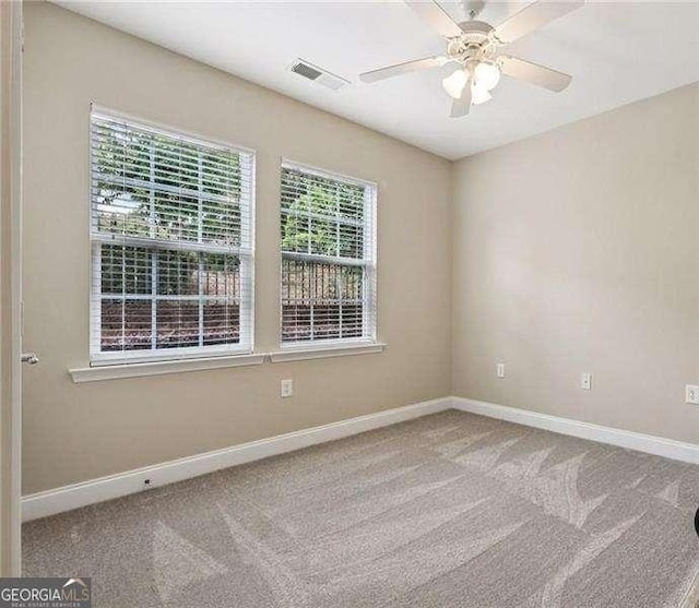 2721 Grapevine Cir Unit 1701, Cumming, GA 30041 - carpeted spare room with baseboards and a ceiling fan