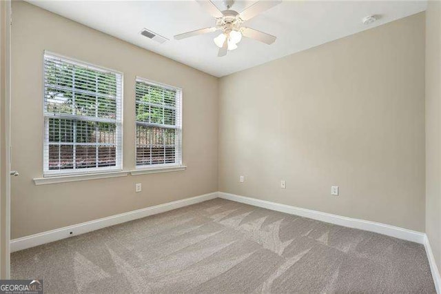 2721 Grapevine Cir Unit 1701, Cumming, GA 30041 - spare room with a ceiling fan, carpet, and a smoke detector