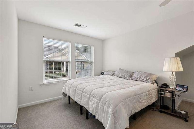 2721 Grapevine Cir Unit 1701, Cumming, GA 30041 - bedroom featuring carpet flooring and baseboards