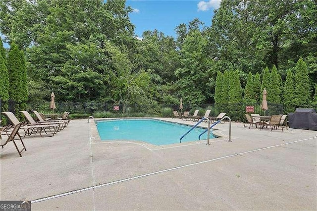 2721 Grapevine Cir Unit 1701, Cumming, GA 30041 - community pool featuring a patio and area for grilling