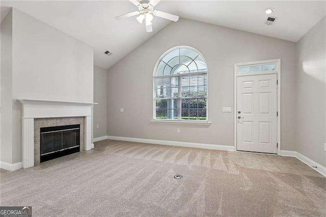 2721 Grapevine Cir Unit 1701, Cumming, GA 30041 - unfurnished living room with a ceiling fan, carpet floors, vaulted ceiling, and a tiled fireplace