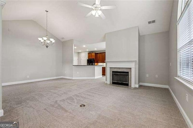 2721 Grapevine Cir Unit 1701, Cumming, GA 30041 - unfurnished living room with lofted ceiling, light colored carpet, a ceiling fan, a chandelier, and a fireplace with flush hearth