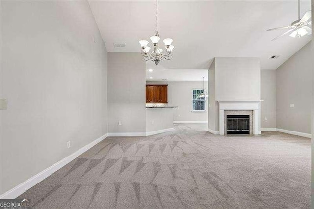 2721 Grapevine Cir Unit 1701, Cumming, GA 30041 - unfurnished living room featuring a chandelier, ceiling fan, light colored carpet, and a fireplace with flush hearth