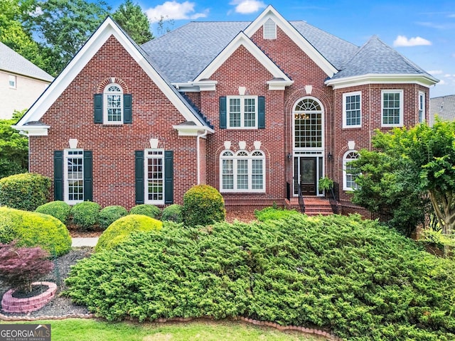1000 Gunter Ct, Alpharetta, GA 30022 - georgian-style home with brick siding and a shingled roof