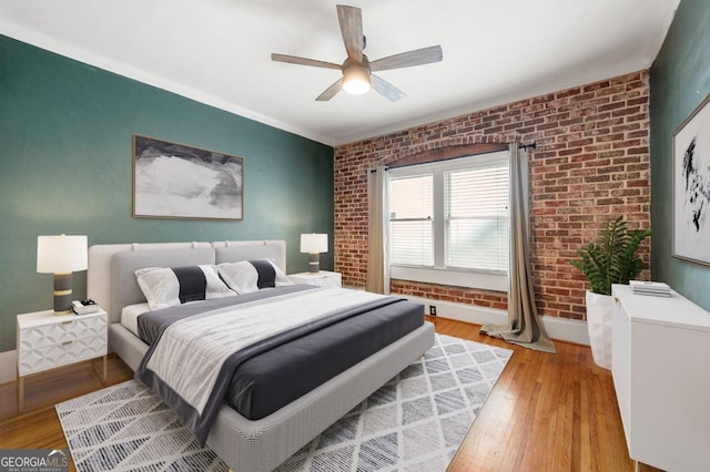 960 Taft Ave NE Unit 9, Atlanta, GA 30309 - bedroom featuring brick wall, light wood-style floors, crown molding, and a ceiling fan