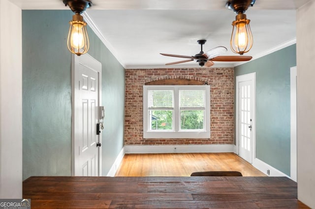 960 Taft Ave NE Unit 9, Atlanta, GA 30309 - entryway featuring ornamental molding, ceiling fan, wood finished floors, and brick wall
