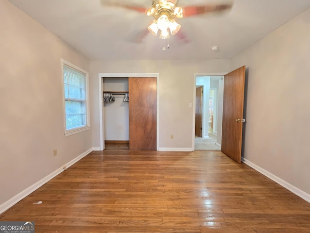 104 Denham St, Thomaston, GA 30286 - unfurnished bedroom with wood finished floors, a closet, and a ceiling fan