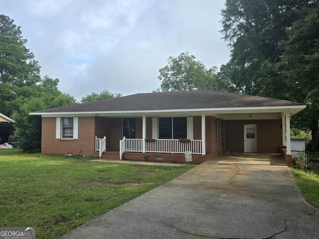 104 Denham St, Thomaston, GA 30286 - single story home with concrete driveway, a porch, a front yard, brick siding, and a carport