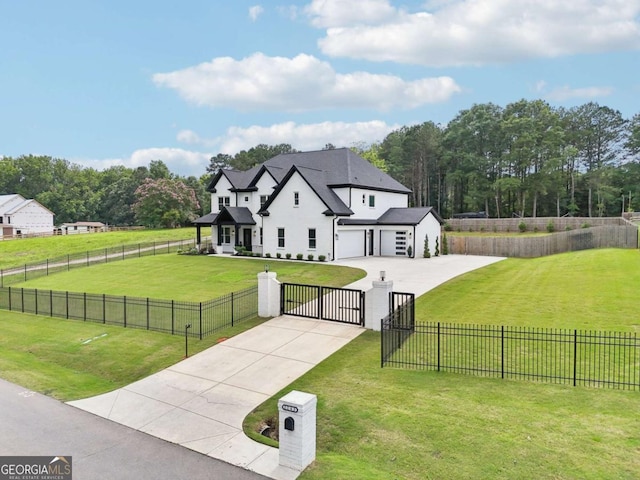 2243 Cain Cir, Dacula, GA 30019 - surrounding community featuring concrete driveway, a fenced front yard, a gate, and a garage