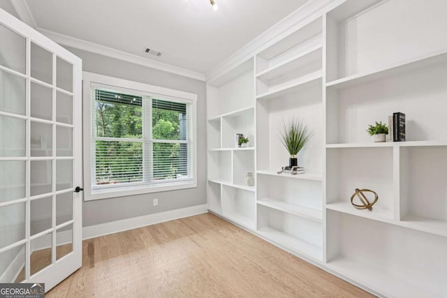 2243 Cain Cir, Dacula, GA 30019 - unfurnished dining area featuring ornamental molding and wood finished floors