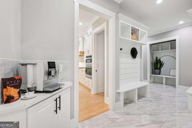 2243 Cain Cir, Dacula, GA 30019 - mudroom with recessed lighting and light marble finish floors