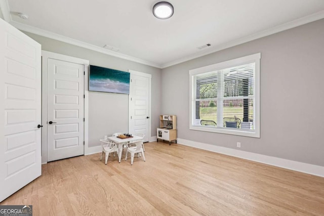 2243 Cain Cir, Dacula, GA 30019 - bedroom featuring light wood-style flooring and crown molding