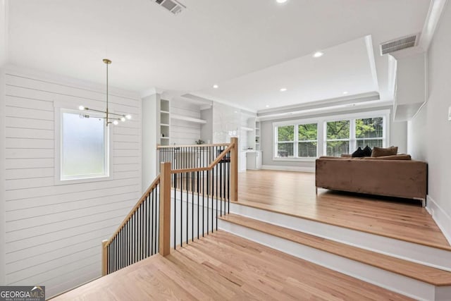 2243 Cain Cir, Dacula, GA 30019 - stairs featuring wood finished floors, a chandelier, and recessed lighting