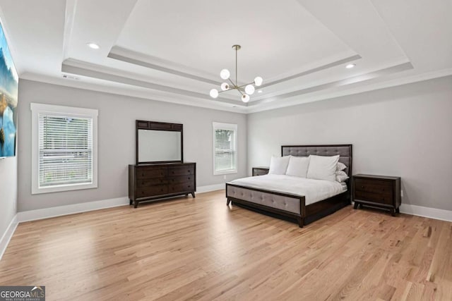 2243 Cain Cir, Dacula, GA 30019 - bedroom featuring a tray ceiling, a chandelier, light wood-type flooring, ornamental molding, and recessed lighting