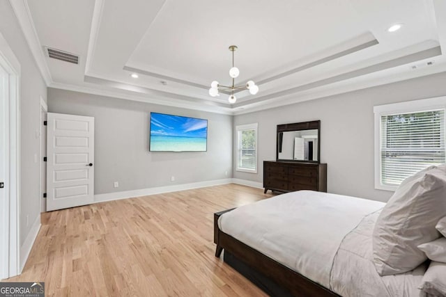 2243 Cain Cir, Dacula, GA 30019 - bedroom with a tray ceiling, light wood finished floors, crown molding, and recessed lighting