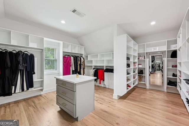 2243 Cain Cir, Dacula, GA 30019 - spacious closet with light wood-type flooring and lofted ceiling