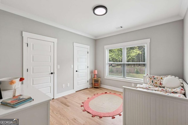 2243 Cain Cir, Dacula, GA 30019 - bedroom with light wood finished floors and ornamental molding