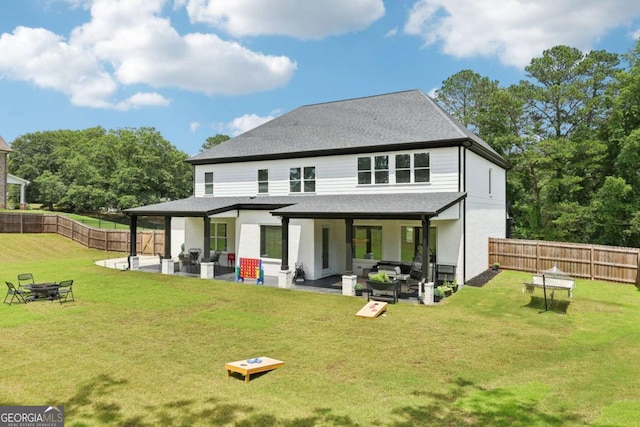 2243 Cain Cir, Dacula, GA 30019 - rear view of property with a fenced backyard, an outdoor living space with a fire pit, a patio, and roof with shingles