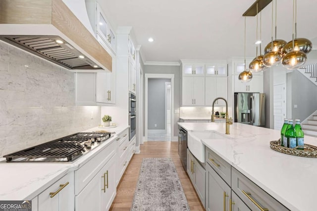 2243 Cain Cir, Dacula, GA 30019 - kitchen with custom exhaust hood, appliances with stainless steel finishes, backsplash, white cabinetry, and recessed lighting