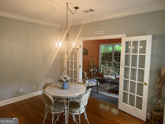 102 Cameron Pointe Dr, Lagrange, GA 30240 - dining area with a chandelier, crown molding, and wood finished floors