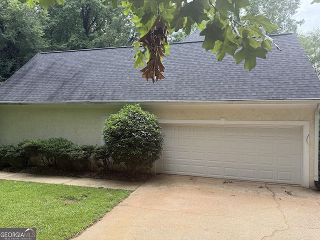 102 Cameron Pointe Dr, Lagrange, GA 30240 - view of home's exterior with a shingled roof, stucco siding, driveway, and an attached garage