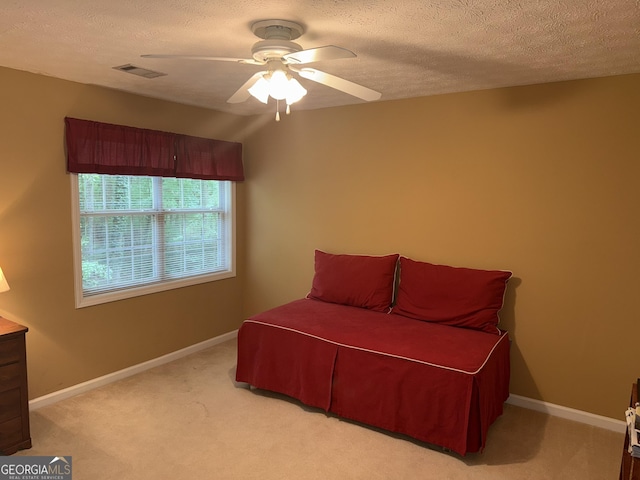 102 Cameron Pointe Dr, Lagrange, GA 30240 - bedroom with light carpet, a textured ceiling, and a ceiling fan