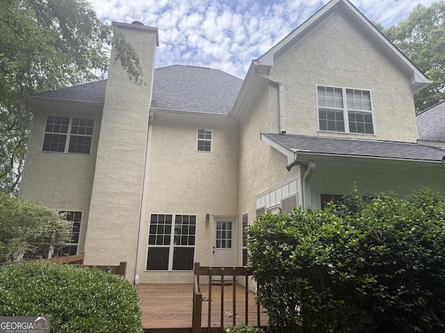 102 Cameron Pointe Dr, Lagrange, GA 30240 - rear view of property with stucco siding, a shingled roof, and a chimney