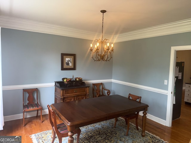 102 Cameron Pointe Dr, Lagrange, GA 30240 - dining area with a chandelier, wood finished floors, and ornamental molding