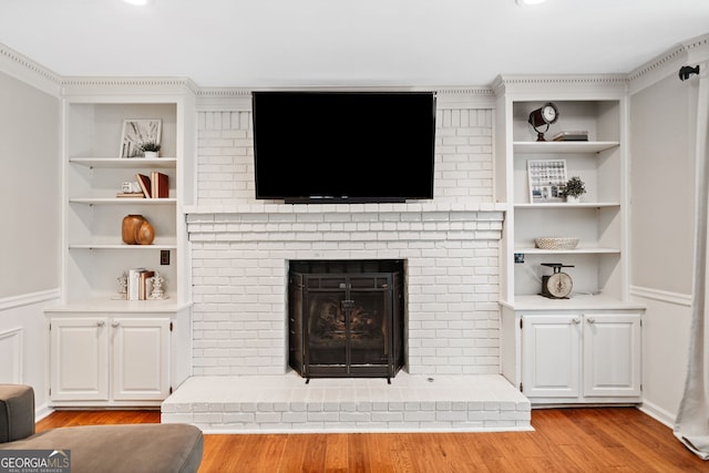 2502 Tritt Springs Trce NE, Marietta, GA 30062 - living room with wood finished floors, built in features, and a fireplace