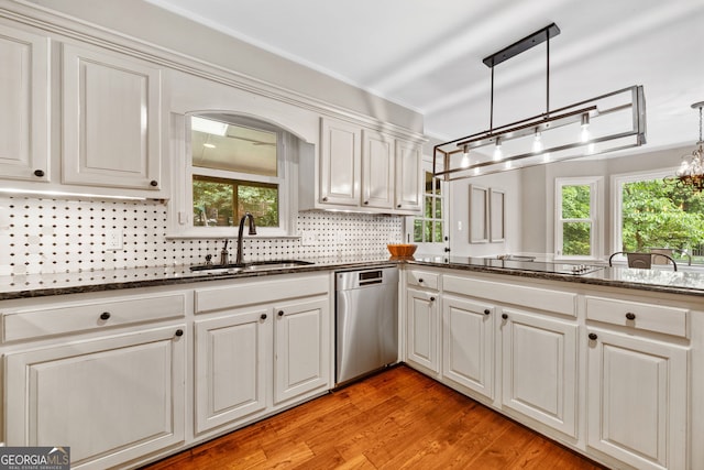 2502 Tritt Springs Trce NE, Marietta, GA 30062 - kitchen featuring stainless steel dishwasher, a chandelier, black electric stovetop, and dark stone counters