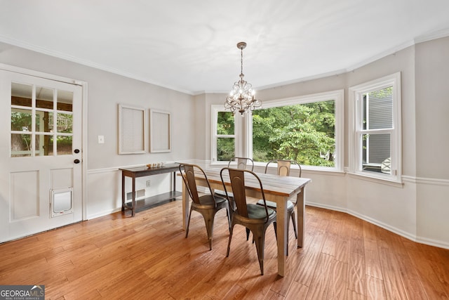 2502 Tritt Springs Trce NE, Marietta, GA 30062 - dining room with a chandelier, light wood finished floors, and crown molding