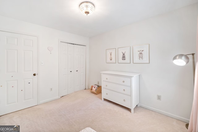 2502 Tritt Springs Trce NE, Marietta, GA 30062 - bedroom featuring light colored carpet and a closet