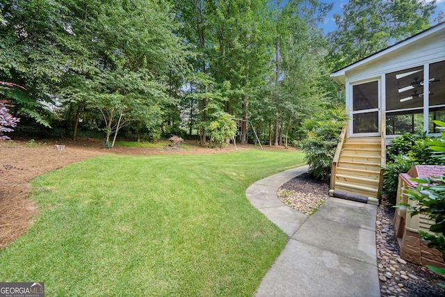 2502 Tritt Springs Trce NE, Marietta, GA 30062 - view of green lawn with stairs and a sunroom