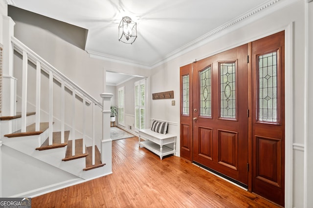 2502 Tritt Springs Trce NE, Marietta, GA 30062 - foyer entrance featuring ornamental molding, wood finished floors, and stairway