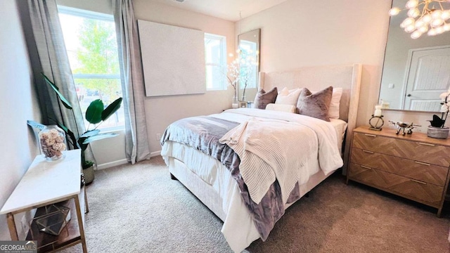 224 College Cir Unit 1013, Hapeville, GA 30354 - carpeted bedroom featuring multiple windows and a chandelier
