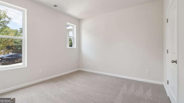 224 College Cir Unit 1013, Hapeville, GA 30354 - carpeted empty room featuring healthy amount of natural light