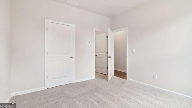 224 College Cir Unit 1013, Hapeville, GA 30354 - unfurnished bedroom featuring carpet flooring and baseboards