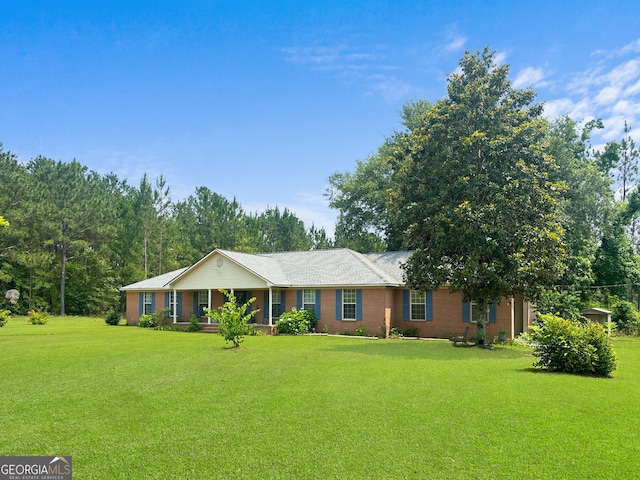 895 Ga Highway 57, Kite, GA 31049 - ranch-style house featuring a front yard