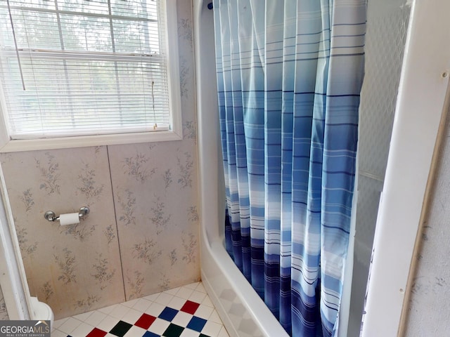 895 Ga Highway 57, Kite, GA 31049 - bathroom featuring tile patterned floors and shower / bathtub combination with curtain