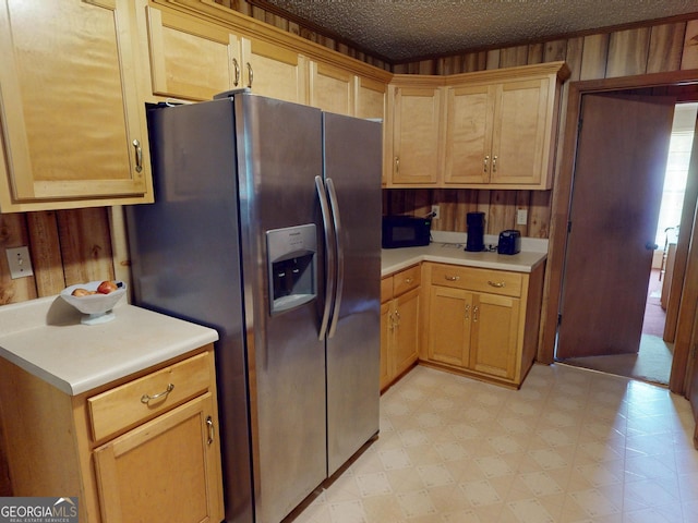 895 Ga Highway 57, Kite, GA 31049 - kitchen with stainless steel refrigerator with ice dispenser, light flooring, light countertops, wooden walls, and black microwave