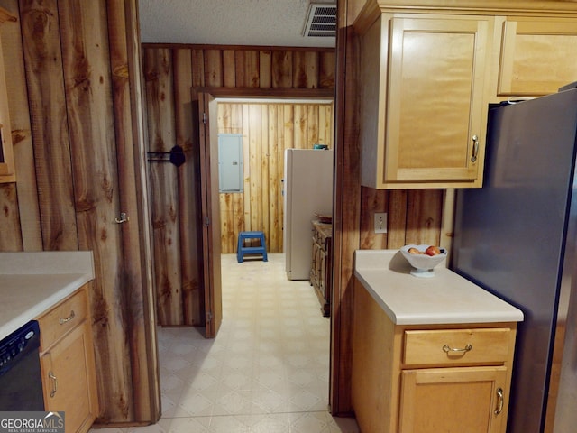 895 Ga Highway 57, Kite, GA 31049 - kitchen with freestanding refrigerator, light floors, wood walls, light countertops, and black dishwasher