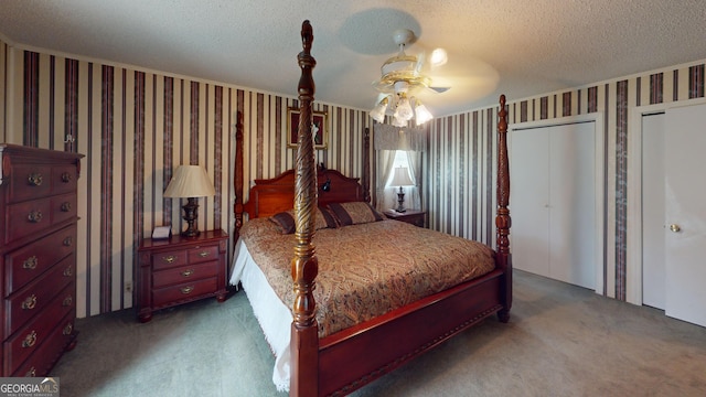 895 Ga Highway 57, Kite, GA 31049 - bedroom featuring carpet flooring, wallpapered walls, a textured ceiling, ceiling fan, and two closets