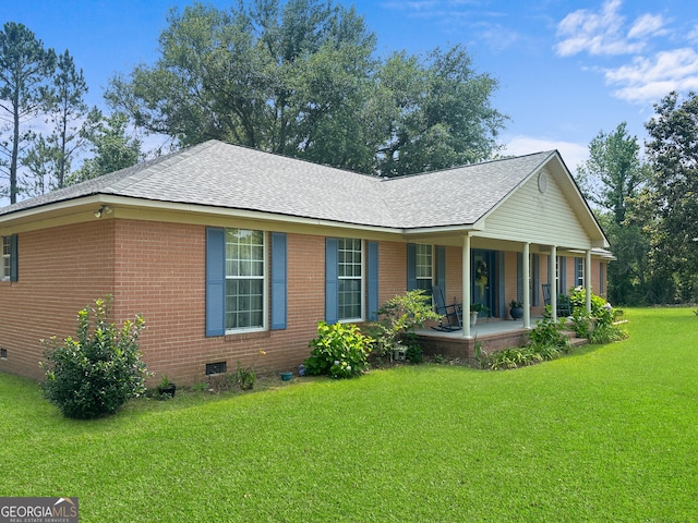 895 Ga Highway 57, Kite, GA 31049 - view of front of property featuring crawl space, covered porch, a front lawn, a shingled roof, and brick siding